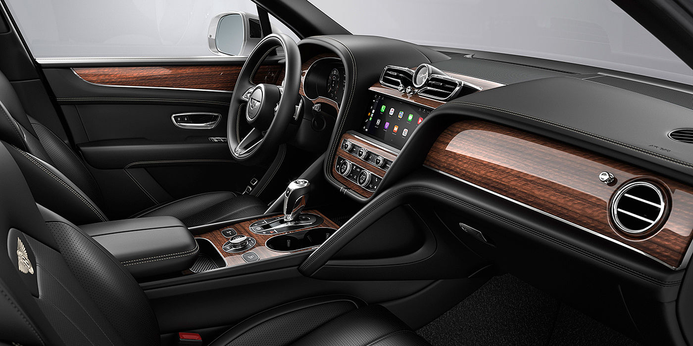 Bentley Changsha Bentley Bentayga interior with a Crown Cut Walnut veneer, view from the passenger seat over looking the driver's seat.
