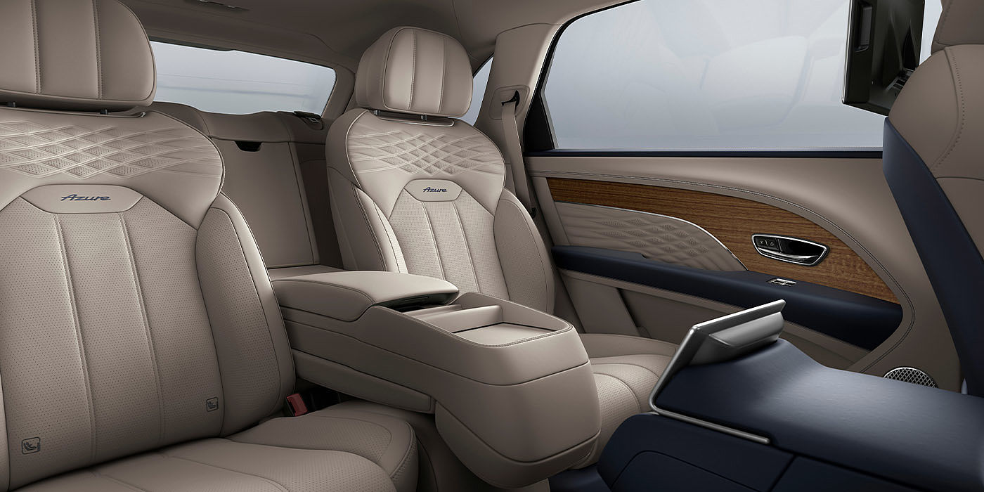 Bentley Changsha Bentley Bentayga EWB Azure interior view for rear passengers with Portland hide featuring Azure Emblem in Imperial Blue contrast stitch.
