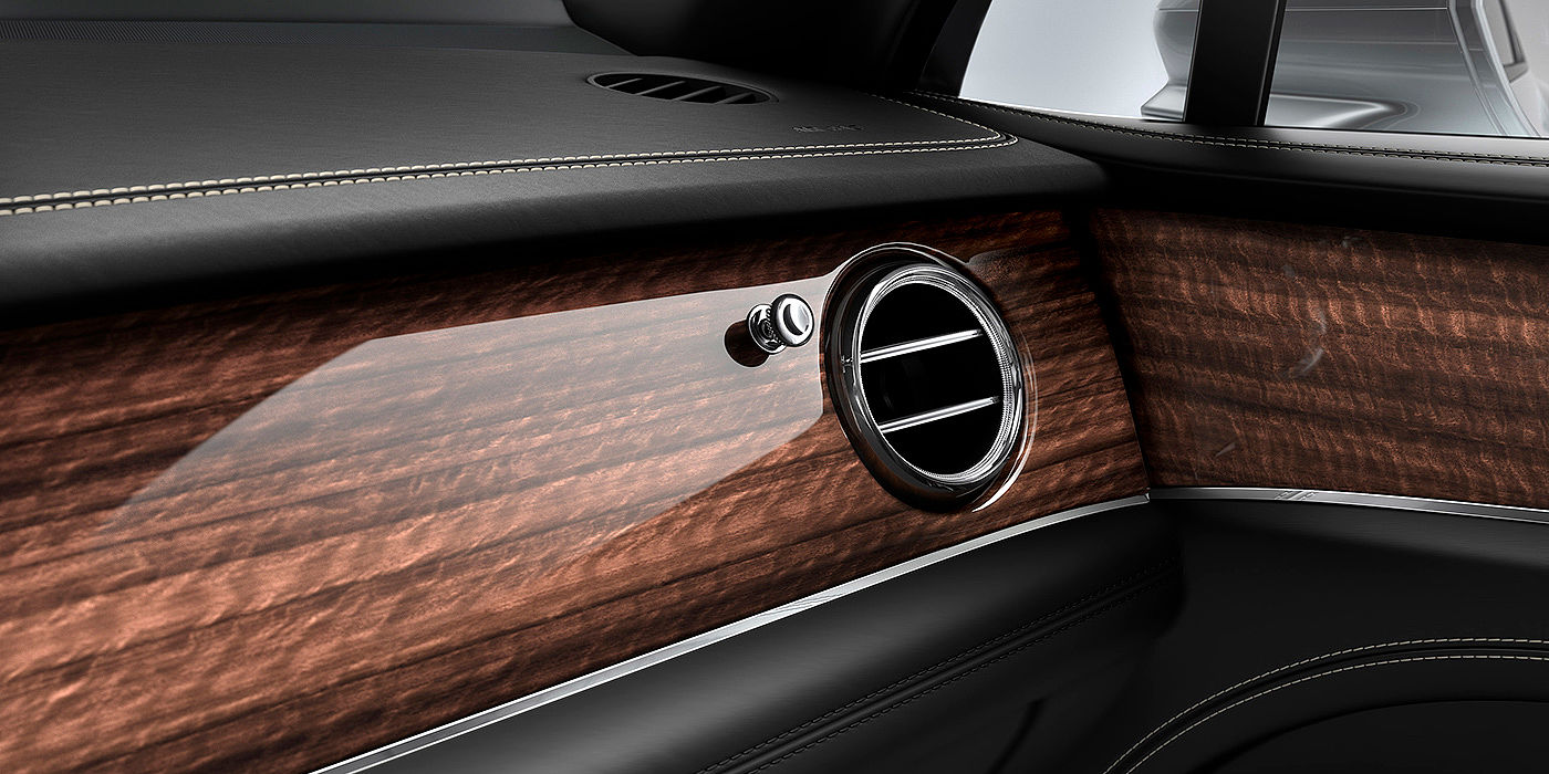 Bentley Changsha Bentley Bentayga front interior Crown Cut Walnut veneer and chrome air vent.