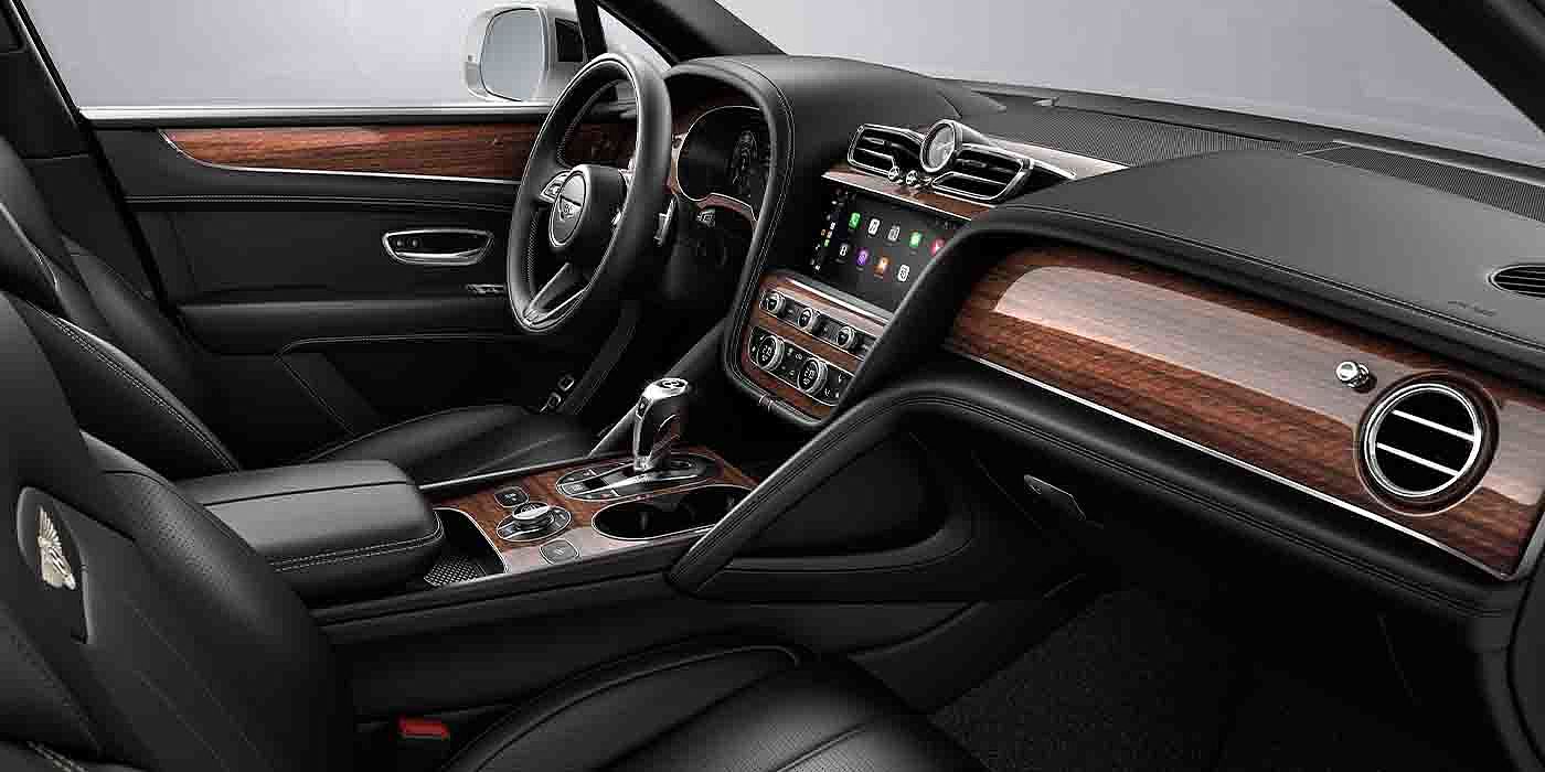 Bentley Changsha Bentley Bentayga EWB interior with a Crown Cut Walnut veneer, view from the passenger seat over looking the driver's seat.